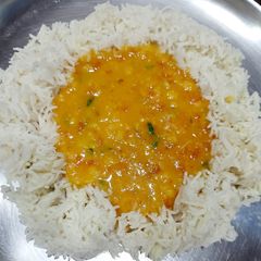 A picture of Arhar Daal tadka with rice.