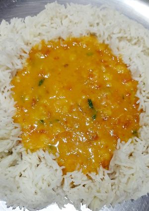 A picture of Arhar Daal tadka with rice.