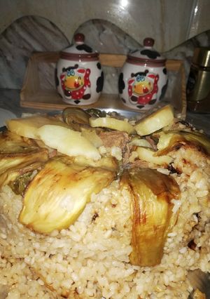 A picture of Maqluba with Lamb and Eggplant.