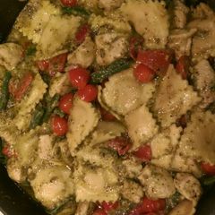 A picture of Roasted red bell pepper and green bean pesto ravioli.