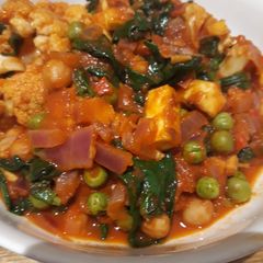 A picture of Roasted cauliflower and paneer "curry".