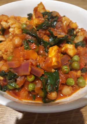 A picture of Roasted cauliflower and paneer "curry".