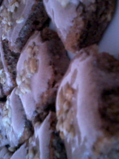 A picture of choco brownies with choco frosting.