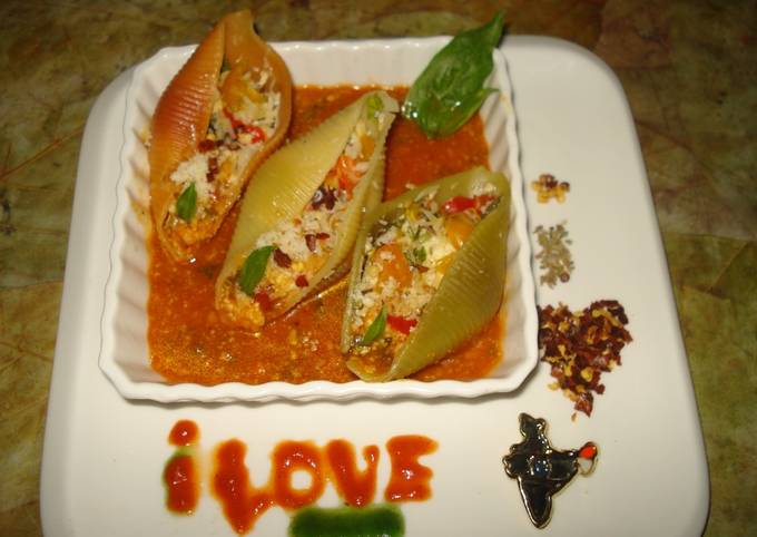 Tricolour pasta shells stuffed with cheeseand bell peppers