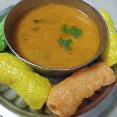 A picture of Tomato curry or Saar.