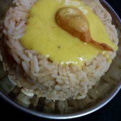 A picture of Plain rice with curry.
