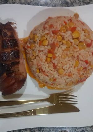 A picture of Special jollof and roasted chicken.