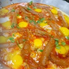A picture of Sausages & Eggs Shakshuka.