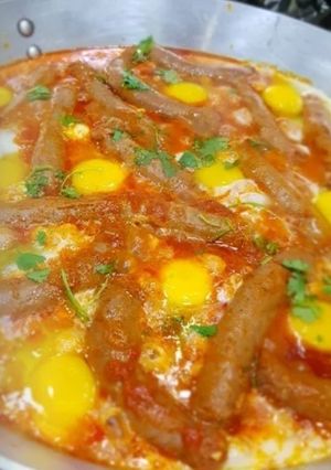 A picture of Sausages & Eggs Shakshuka.