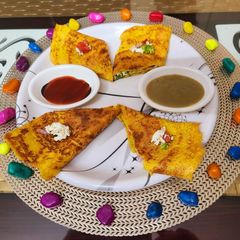 A picture of Paneer stuffed moong dal chilla.
