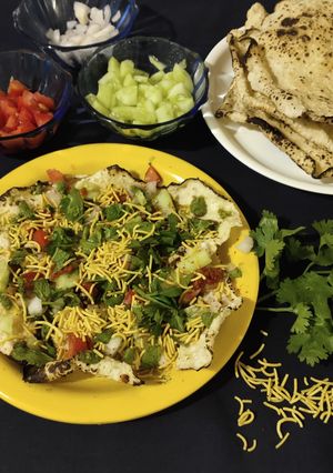 A picture of Khichiya papad (rice papad) chat.