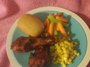 A picture of bbq chicken legs in oven