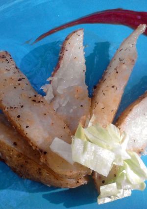 A picture of Parmesan Crusted Potatoe Wedges.