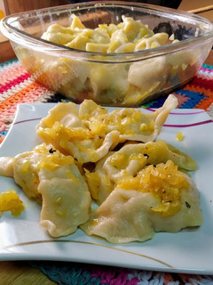 Una foto de Pasta rellena de papas y ricota