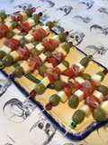 Appetizer Skewers with Green Olives, Tomato, Prosciutto, and Pyrenees Cheese