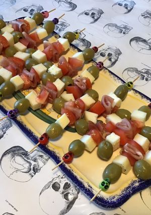 A picture of Appetizer Skewers with Green Olives, Tomato, Prosciutto, and Pyrenees Cheese.