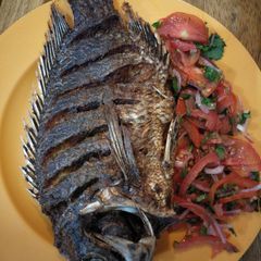 A picture of Fried fish with kachumbari.