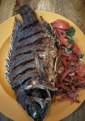 A picture of Fried fish with kachumbari.