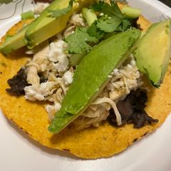 A picture of Salsa verde tostadas in the slow cooker.