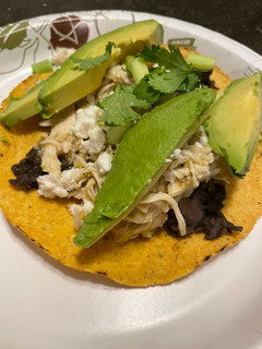 A picture of Salsa verde tostadas in the slow cooker.