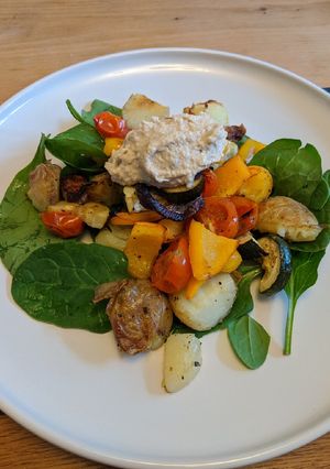 A picture of Mixed veg with potatoes, spinach and caramelised onion hummus.