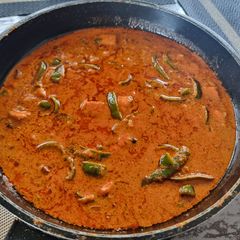 A picture of Paneer cashew capsicum in curd based gravy.