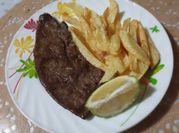 Une photo de frite a la poêle