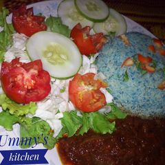 A picture of Cous Cous, Sauce and Veggies.