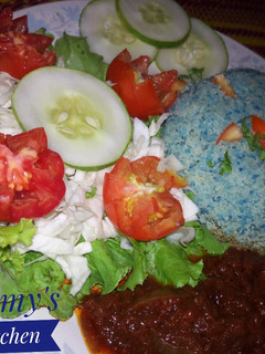 A picture of Cous Cous, Sauce and Veggies.