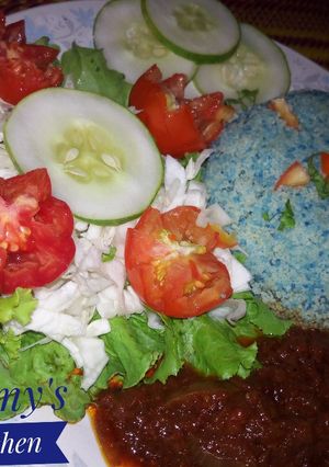 A picture of Cous Cous, Sauce and Veggies.