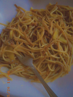 A picture of Plain brown spagetti.