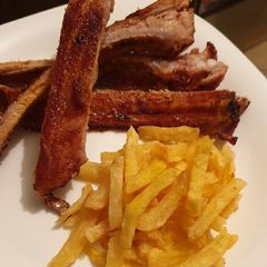 A picture of Home made Barbecue ribs with homemade Barbecue sauce.