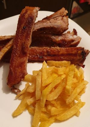 A picture of Home made Barbecue ribs with homemade Barbecue sauce.