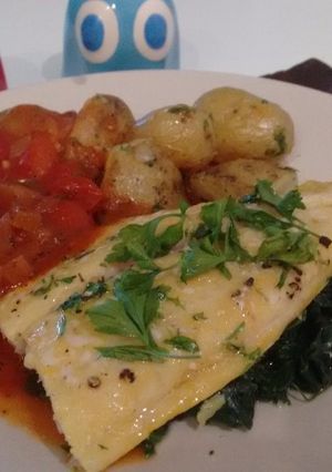 A picture of Smoked River cobbler fillets with a cherry tomato sauce.