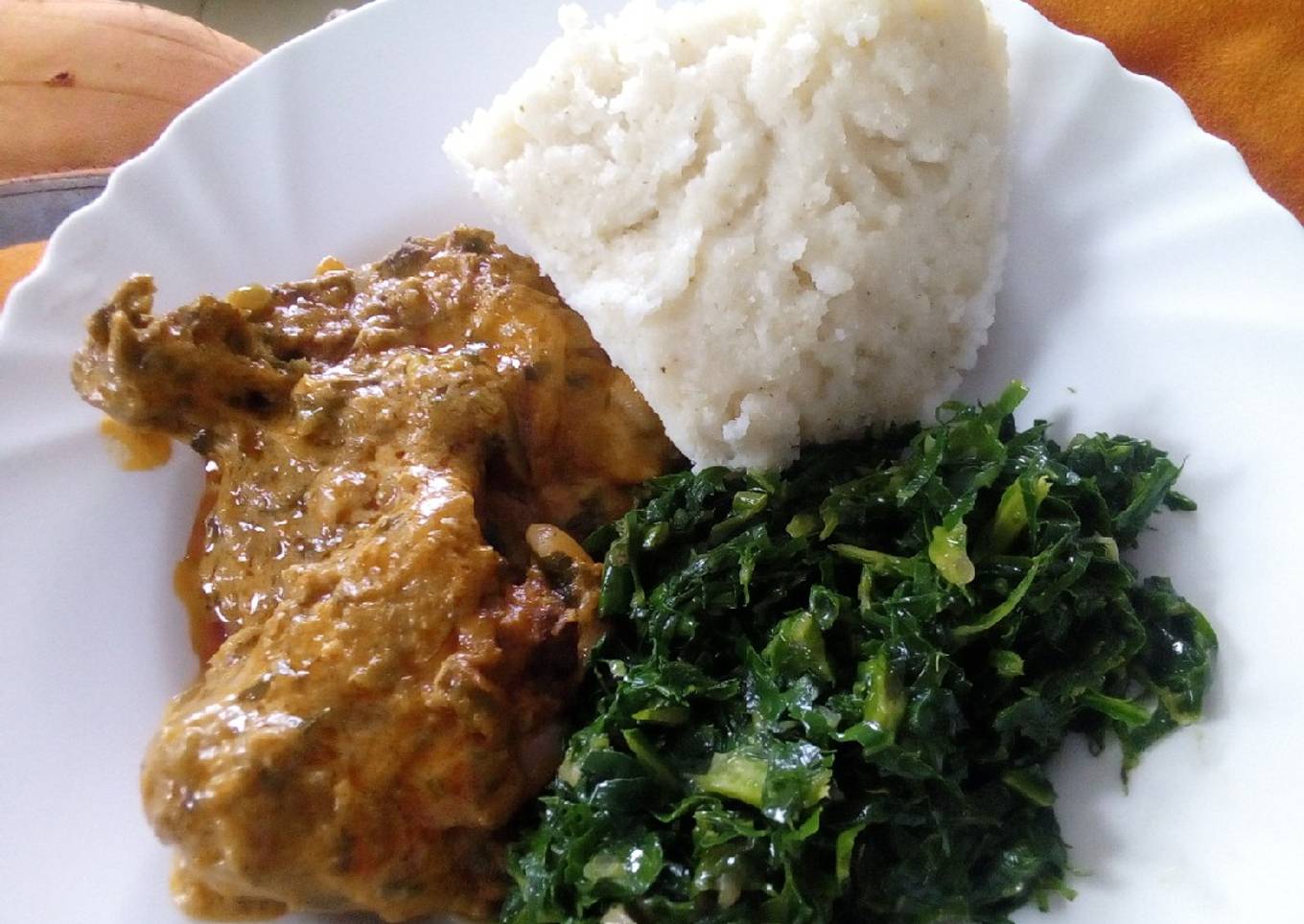 Ugali,chicken stew with mala and sukumawiki