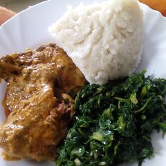 A picture of Ugali,chicken stew with mala and sukumawiki.
