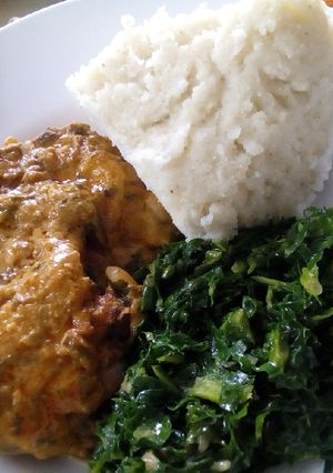 A picture of Ugali,chicken stew with mala and sukumawiki.