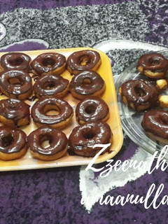 A picture of Homemade Chocolate Glazed Doughnuts and Mini Doughnuts.