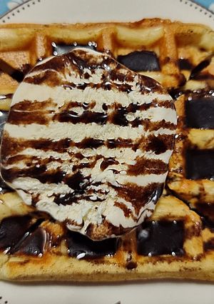 A picture of Eggless Waffle with ice cream.