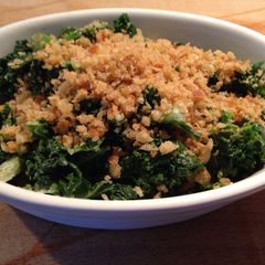 A picture of Curly Kale with Cream and Crispy Breadcrumbs.