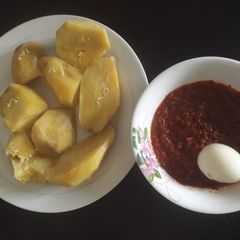 A picture of Sweet potato with stew and egg.