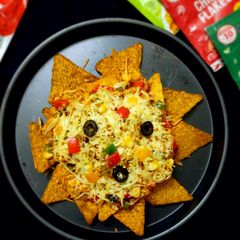 A picture of Cheesy loaded vegetable Nachos.