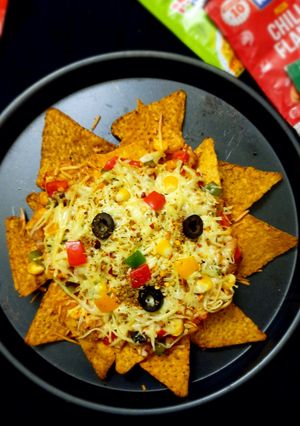 A picture of Cheesy loaded vegetable Nachos.