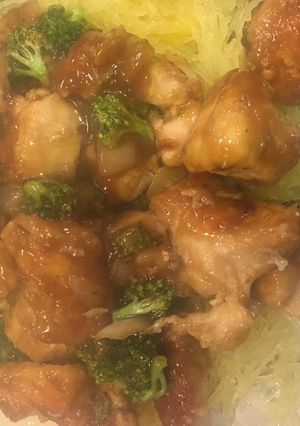 A picture of Broccoli and chicken stir fry.