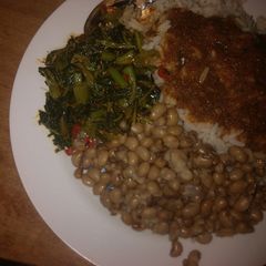 A picture of White rice,beans and spinach salad.