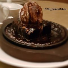 A picture of Chocolate Cake with Ice cream Sauce.