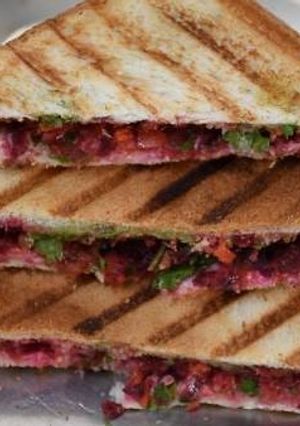 A picture of Carrot and beetroot sandwich.