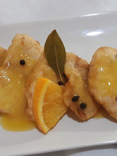 Una foto de Merluza con salsa de naranja