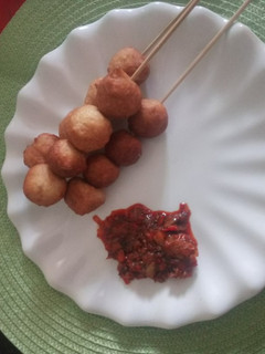 A picture of Puff-Puff & Pepper Sauce.