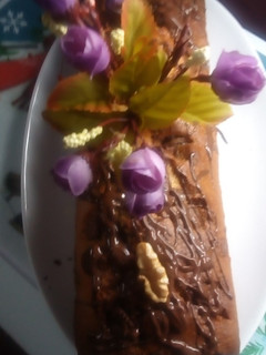 Una foto de Budín de vainilla, con trocitos de chocolate y nueces
